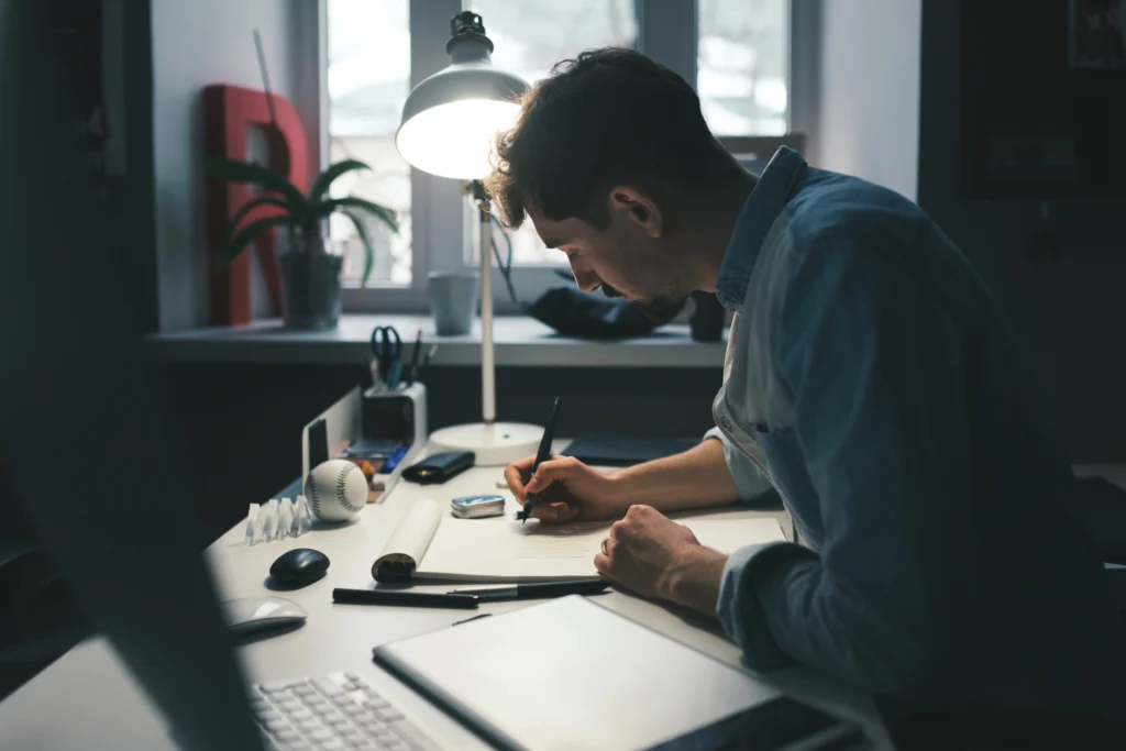 brand designer in an office working on visual identity for a rebrand project