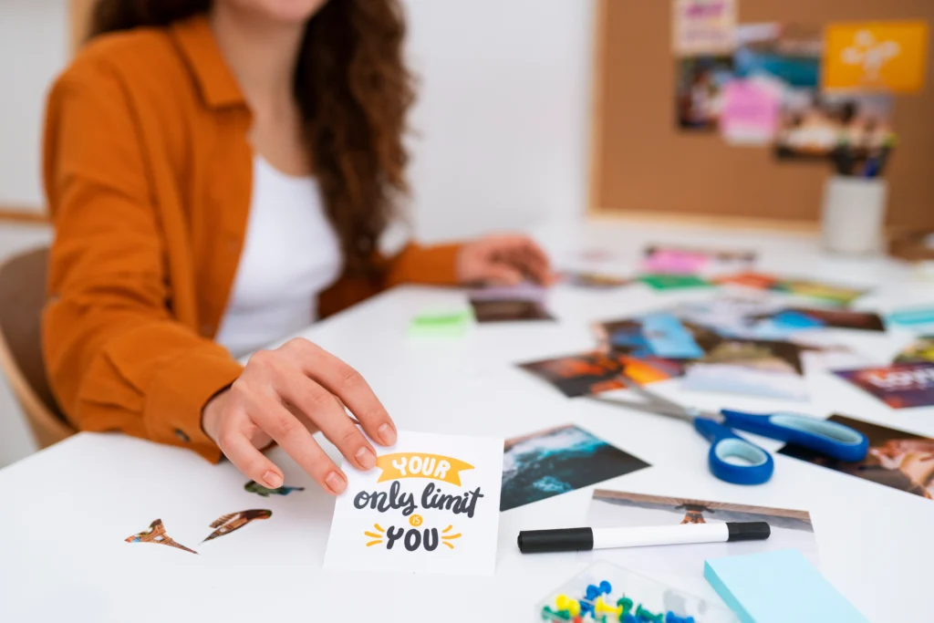 woman creating a vision board to explore brand direction before deciding when to rebrand
