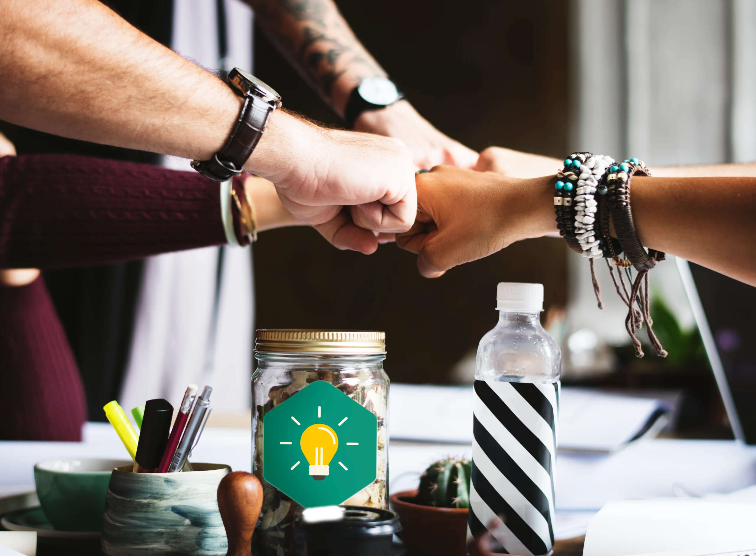 team collaboration fist bump workspace
